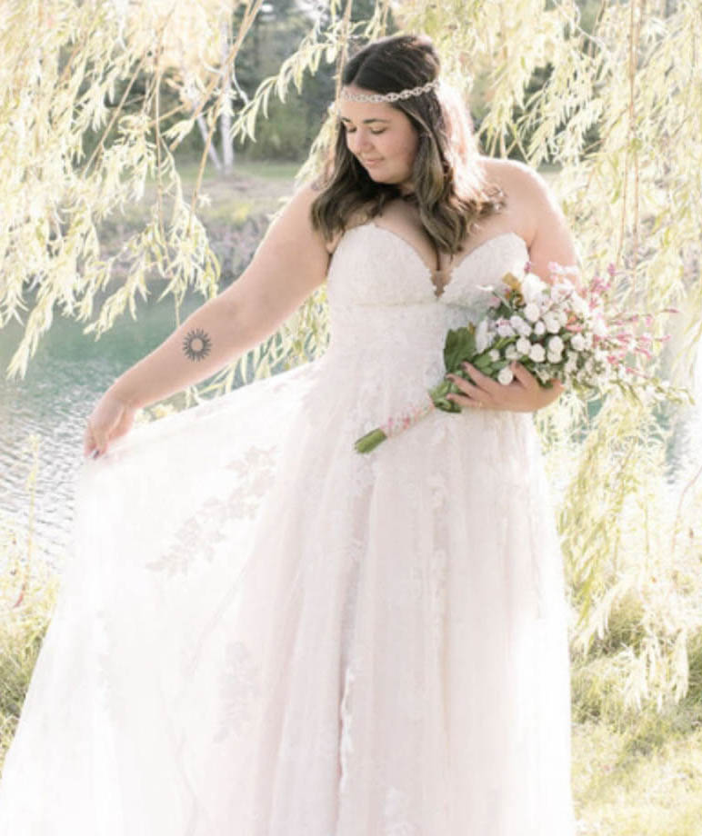 Model wearing a white gown