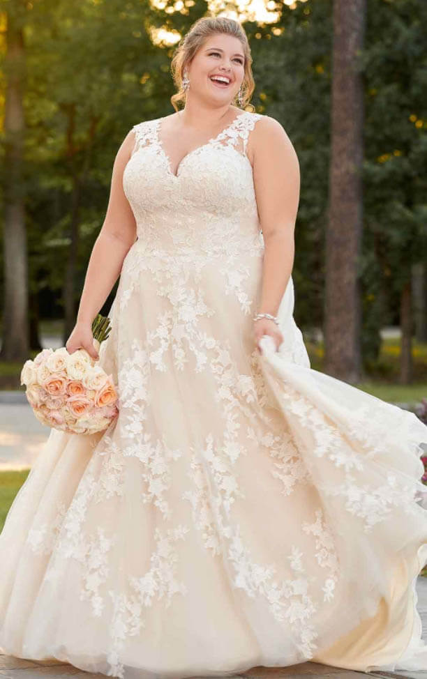 Model wearing a white gown by Stella York