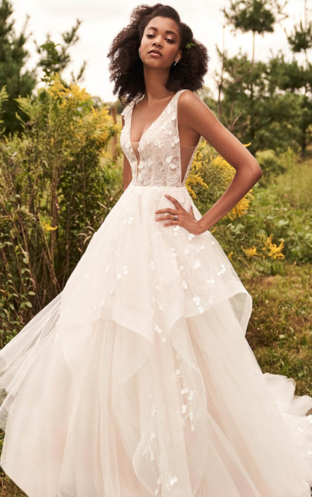 Model wearing a white gown by Lillian West