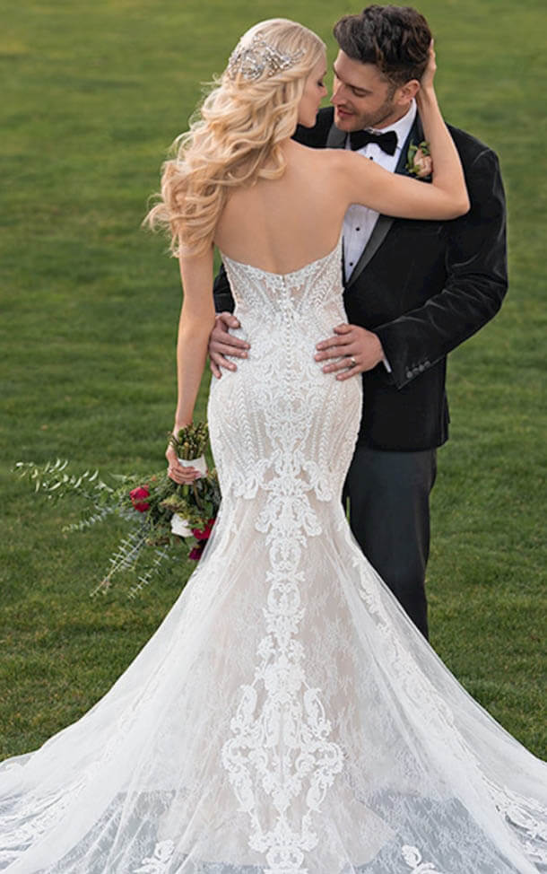 Model wearing a white gown by Martina Liana