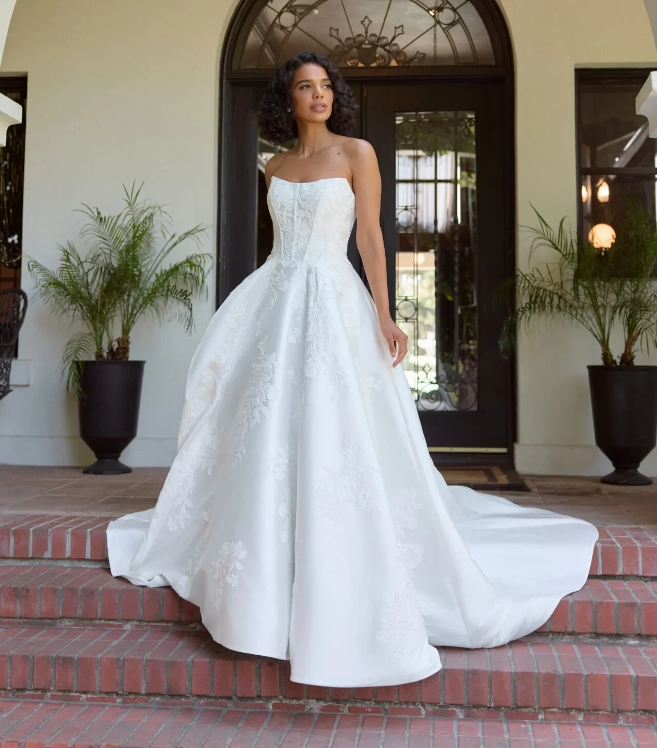 Model wearing a white gown by Essense of Australia