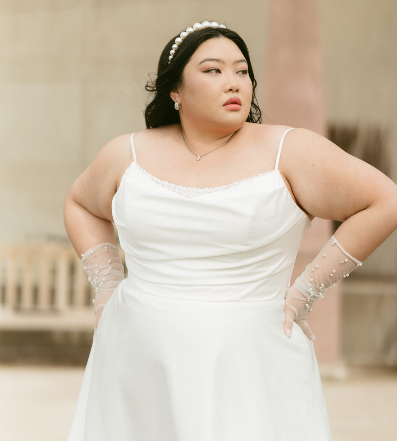 Model wearing a white gown by Stella York
